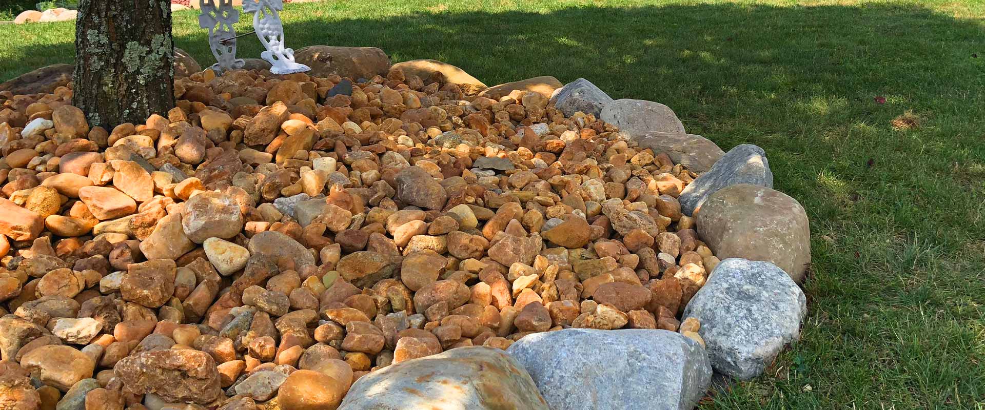 Stone and boulder tree bed