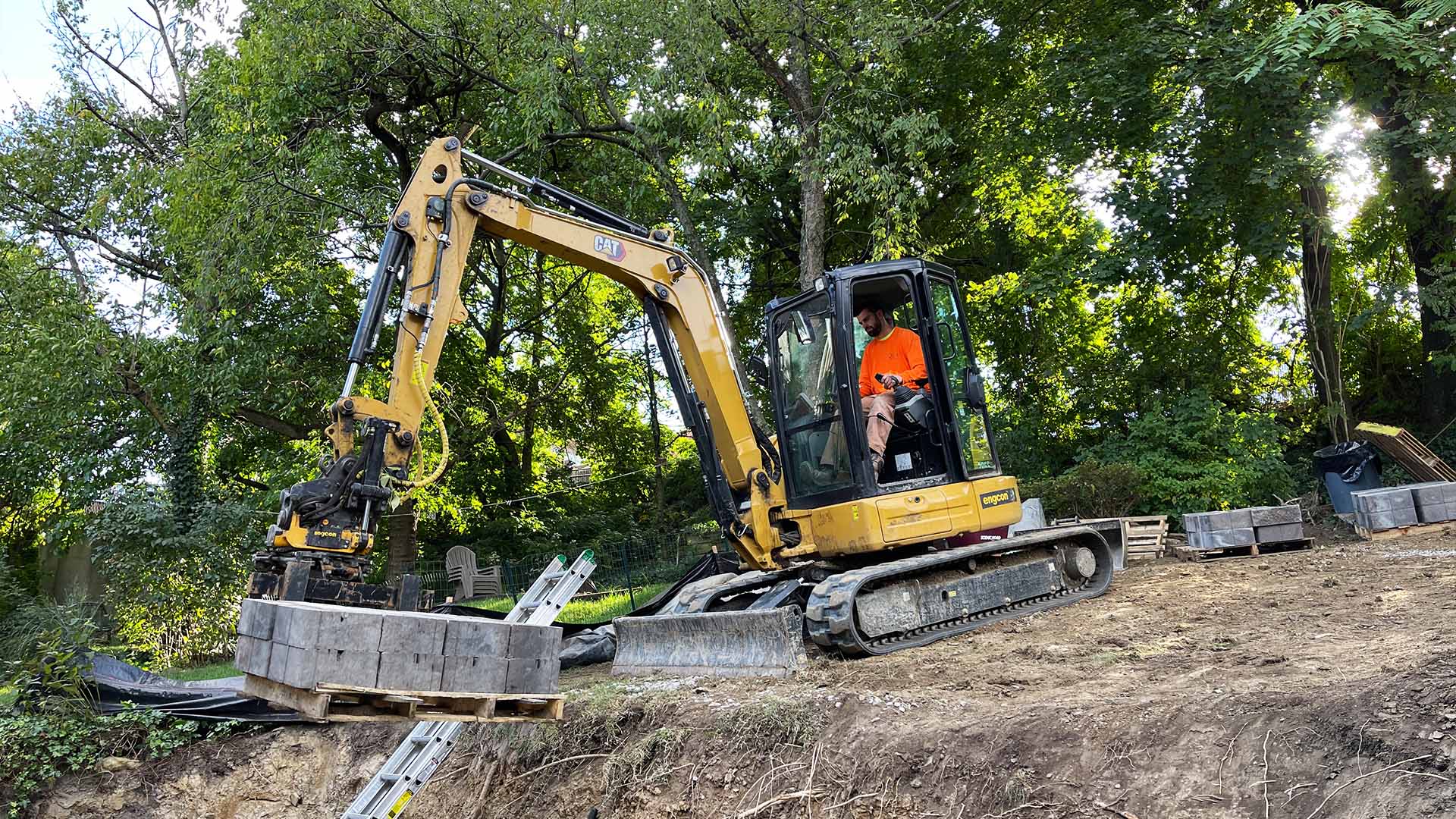 Versa-Lok retaining wall rebuild on a tight-access site