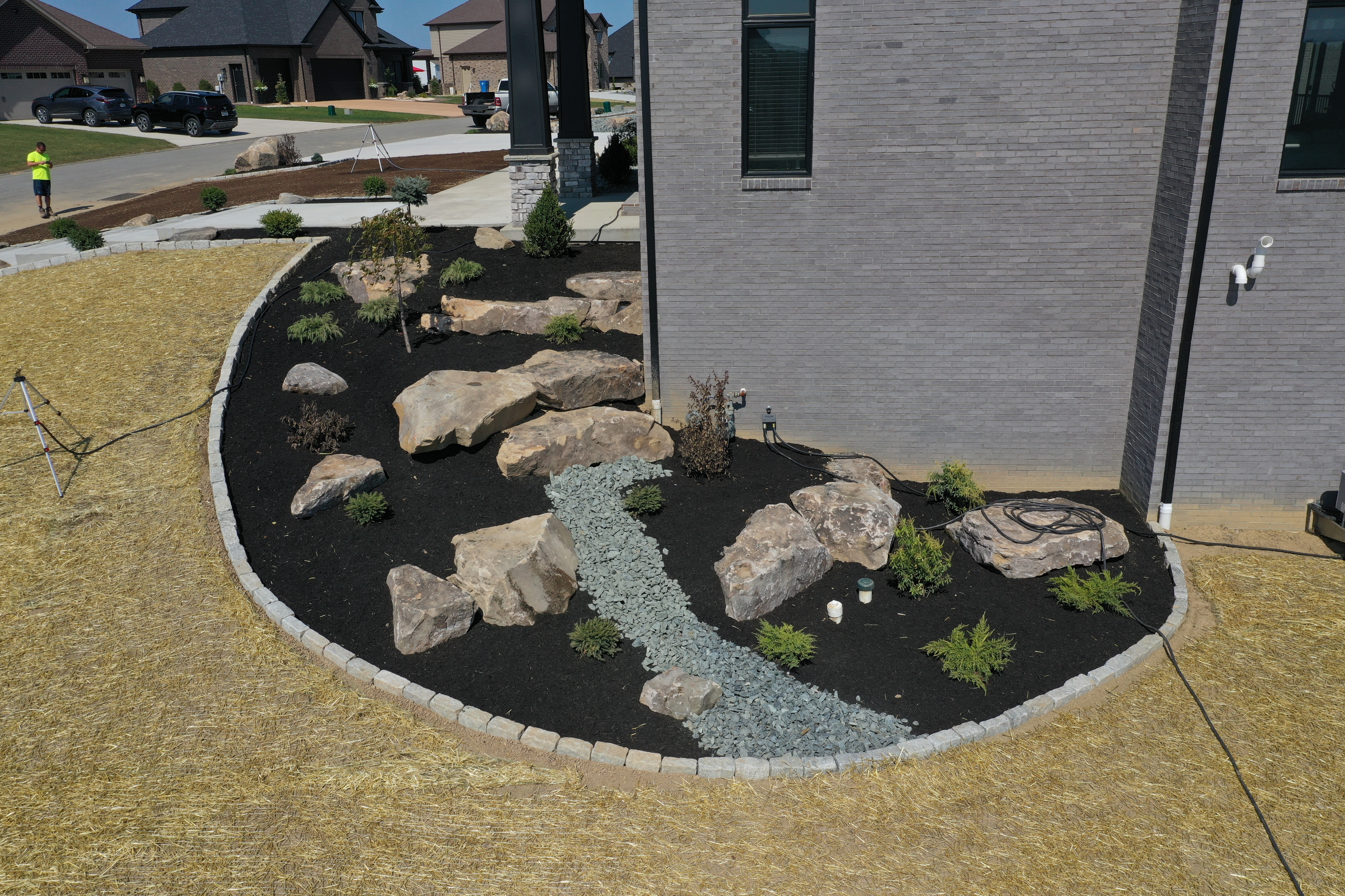 Mulch bed with boulders and dry creek bed at North Huntingdon home