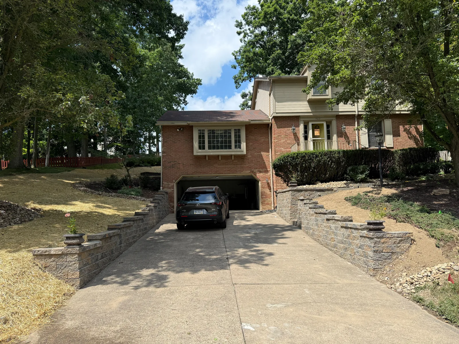 Two new Versa-Lok retaining walls on either side of the driveway at an Upper St. Clair home