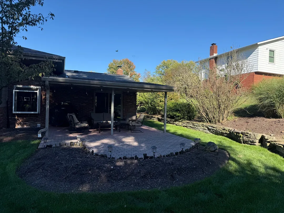 Before: the old paver patio and covered patio area at the back of the house